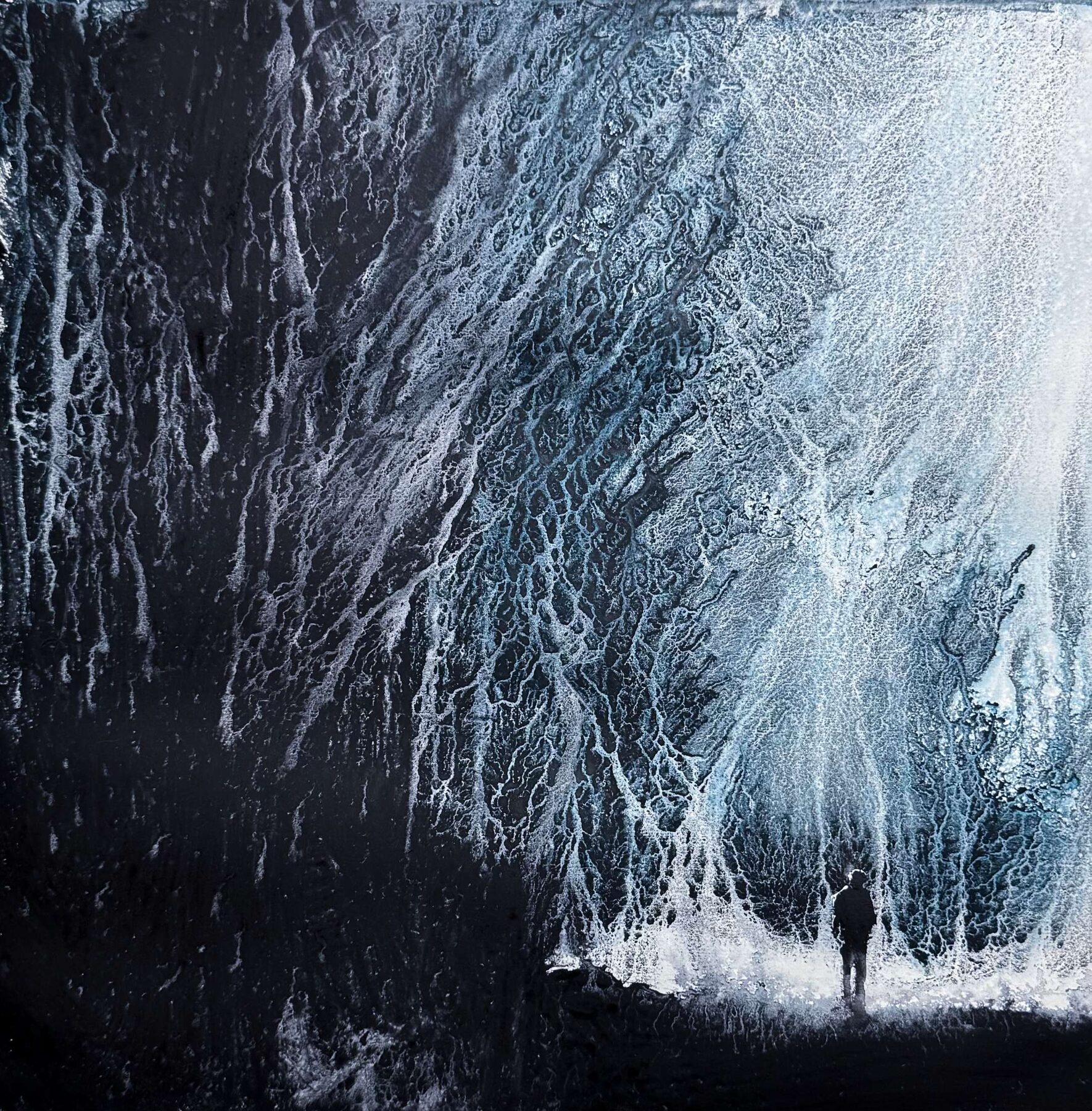 Small silhouette figure beside a large dark mass in the form of intricate branches